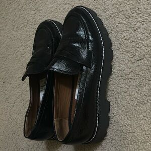 Black shiny log sole loafers